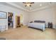 Cozy bedroom with walk-in closet, ceiling fan and a glimpse of the Primary bathroom at 40 Westbrook Rd, Carrollton, GA 30116