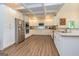 Bright kitchen featuring white cabinets, granite countertops, and stainless steel appliances at 40 Westbrook Rd, Carrollton, GA 30116