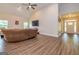 Spacious living room with hardwood floors, a large couch, and a television at 40 Westbrook Rd, Carrollton, GA 30116