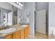 En-suite bathroom includes a double sink vanity with lots of storage and a large mirror at 52 Cherub Ln, Sharpsburg, GA 30277