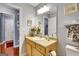 Bathroom features a large mirror, light-toned vanity, and convenient open access to another room at 52 Cherub Ln, Sharpsburg, GA 30277