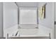 Bright bathroom featuring a white soaking tub under a window with blinds at 52 Cherub Ln, Sharpsburg, GA 30277