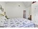 Bedroom with a large window, white vaulted ceiling, and a patterned bedspread at 52 Cherub Ln, Sharpsburg, GA 30277