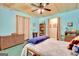 A charming bedroom with light blue walls, wooden ceiling, and decorated with wicker furniture at 52 Cherub Ln, Sharpsburg, GA 30277