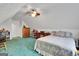 Bedroom in loft features a bed, dresser, ceiling fan and storage; carpet flooring at 52 Cherub Ln, Sharpsburg, GA 30277