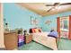 Comfortable bedroom with bright colors and beach themed decor with bedside wicker furniture at 52 Cherub Ln, Sharpsburg, GA 30277