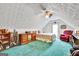 Cozy bedroom in a loft with sloped ceilings and dormer window, plus reading nook at 52 Cherub Ln, Sharpsburg, GA 30277