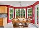 Bright dining area features a view of the deck and lots of natural light at 52 Cherub Ln, Sharpsburg, GA 30277