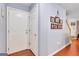 Foyer area with a white front door and stairway, plus wood floors at 52 Cherub Ln, Sharpsburg, GA 30277