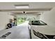 Clean garage with an automatic door and exterior view of the home's driveway and front yard at 52 Cherub Ln, Sharpsburg, GA 30277