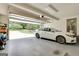 Clean garage with an automatic door and exterior view of the home's driveway and front yard at 52 Cherub Ln, Sharpsburg, GA 30277