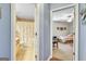 Hallway offering views into the bathroom and a carpeted bedroom, bathed in soft light at 52 Cherub Ln, Sharpsburg, GA 30277