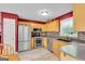 Bright eat-in kitchen featuring stainless steel appliances, granite counters and wood cabinets at 52 Cherub Ln, Sharpsburg, GA 30277