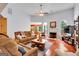 Bright and airy living room with hardwood floors, a cozy fireplace, and a comfortable layout for Gathering gatherings at 52 Cherub Ln, Sharpsburg, GA 30277