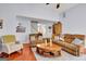Comfortable living room with cozy furniture, hardwood floors, and a welcoming atmosphere for relaxation and social gatherings at 52 Cherub Ln, Sharpsburg, GA 30277
