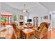Spacious living room featuring a fireplace, large windows, and comfortable seating for relaxation and entertainment at 52 Cherub Ln, Sharpsburg, GA 30277