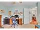Office area with a desk, workspace, and a glimpse into another room at 52 Cherub Ln, Sharpsburg, GA 30277