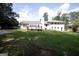 Large backyard features a wooden deck and a well-manicured lawn at 3686 Calmer Cir, East Point, GA 30344