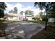 Spacious backyard featuring a basketball court, wooden deck, and lush greenery at 3686 Calmer Cir, East Point, GA 30344