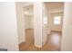 Bright bedroom showcasing light hardwood floors and ample natural light from an adjacent room at 3686 Calmer Cir, East Point, GA 30344