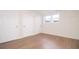 Bright bedroom with vinyl floors, a window, and two closets for ample storage at 3686 Calmer Cir, East Point, GA 30344