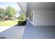 Covered carport has grey flooring and direct entry to the house at 3686 Calmer Cir, East Point, GA 30344
