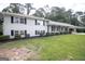 White brick home has a covered porch with black shutters and well-manicured yard at 3686 Calmer Cir, East Point, GA 30344