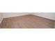 Close up of the new vinyl flooring in an empty room with white base trim at 3686 Calmer Cir, East Point, GA 30344