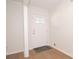 White entry door with decorative window pane and wood flooring at 3686 Calmer Cir, East Point, GA 30344