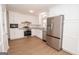 Bright kitchen features new stainless steel appliances, granite countertops, and white cabinets at 3686 Calmer Cir, East Point, GA 30344