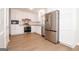 Bright kitchen features new stainless steel appliances, granite countertops, and white cabinets at 3686 Calmer Cir, East Point, GA 30344