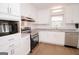 Eat-in kitchen with stainless appliances, granite counters, and modern white cabinetry at 3686 Calmer Cir, East Point, GA 30344