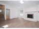 Living room features hardwood floors, a fireplace, natural light, and access to the second floor at 3686 Calmer Cir, East Point, GA 30344