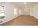Sun-drenched living area with hardwood flooring, many windows and view to the front yard at 3686 Calmer Cir, East Point, GA 30344
