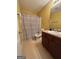 Bright bathroom features a patterned shower curtain and classic vanity at 375 Sapphire Bnd, Riverdale, GA 30296