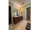 Well-lit bathroom with a double vanity, large mirror, and tile flooring at 375 Sapphire Bnd, Riverdale, GA 30296