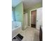 Bathroom with a bathtub, shower and vanity, and a doorway to a closet at 375 Sapphire Bnd, Riverdale, GA 30296