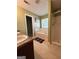 Bathroom featuring a bathtub, shower, and vanity area with tile flooring and soft green walls at 375 Sapphire Bnd, Riverdale, GA 30296
