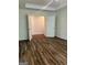 Bedroom with hardwood floors, bright lighting, and double doors at 375 Sapphire Bnd, Riverdale, GA 30296
