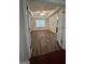 Bright bedroom with a tray ceiling, hardwood flooring, and a large window providing natural light at 375 Sapphire Bnd, Riverdale, GA 30296