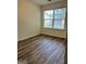 Bedroom with hardwood floors, natural light, and neutral walls at 375 Sapphire Bnd, Riverdale, GA 30296