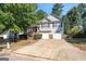 Two-story home featuring a two-car garage, and a quaint entrance with steps at 375 Sapphire Bnd, Riverdale, GA 30296