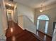 Well-lit foyer with hardwood floors and an arched window above the front door at 375 Sapphire Bnd, Riverdale, GA 30296