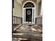Charming front door with decorative wreath and sidelights, creating an inviting entrance at 375 Sapphire Bnd, Riverdale, GA 30296