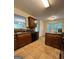 Traditional kitchen with dark wood cabinets and tile flooring at 375 Sapphire Bnd, Riverdale, GA 30296
