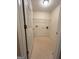 Well-lit laundry room with tile flooring and wire shelving for storage at 375 Sapphire Bnd, Riverdale, GA 30296