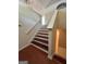 A wooden staircase with white risers is located near the front entrance at 375 Sapphire Bnd, Riverdale, GA 30296