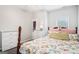 Cozy bedroom features a bright window, patterned bedding, and ample closet space, creating a comfortable retreat at 1010 Capella Creek Way, Grayson, GA 30017