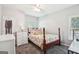 Cozy bedroom featuring a floral patterned bed, soft natural lighting, and a neutral color palette at 1010 Capella Creek Way, Grayson, GA 30017