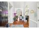 Inviting foyer featuring hardwood floors with a view into an open floor plan at 1010 Capella Creek Way, Grayson, GA 30017